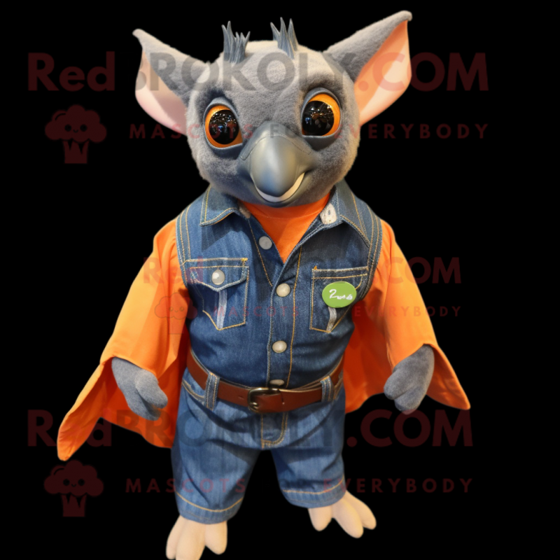 Orange Fruit Bat mascot costume character dressed with a Denim Shirt and Cufflinks