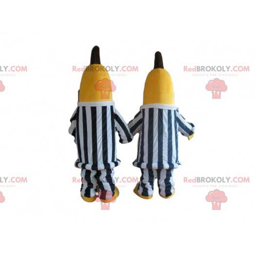 2 mascotes banana em roupas listradas em preto e branco -