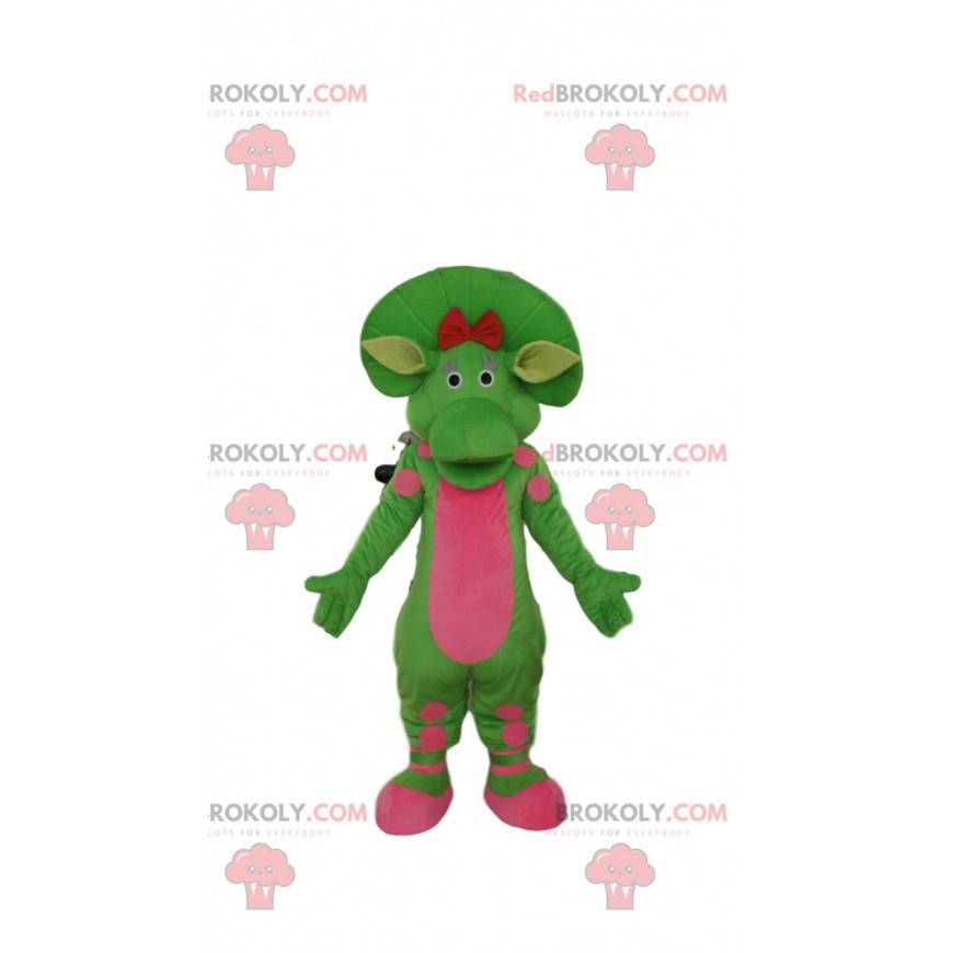 Mascote de dinossauro verde e rosa, traje pré-histórico -