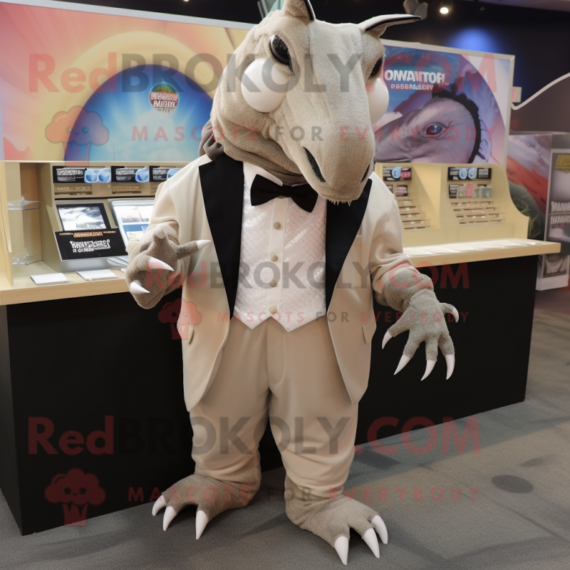 Beige Armadillo mascot costume character dressed with a Tuxedo and Keychains Beige Armadillo mascot costume character dressed with a Tuxedo and Keychains