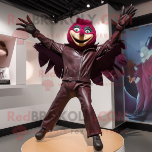 Maroon Trapeze Artist mascot costume character dressed with a Leather Jacket and Cummerbunds