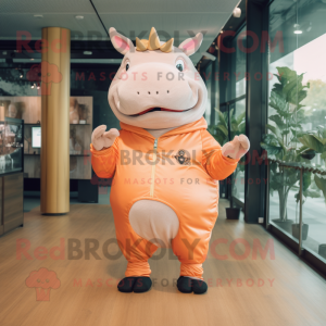 Peach Rhinoceros mascot costume character dressed with a Jeggings and Digital watches