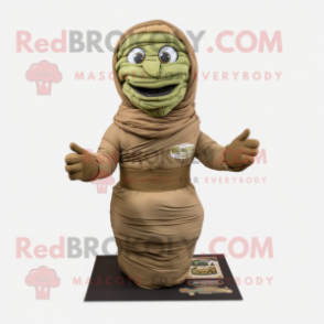 Olive Mummy mascot costume character dressed with a Cargo Pants and Wraps