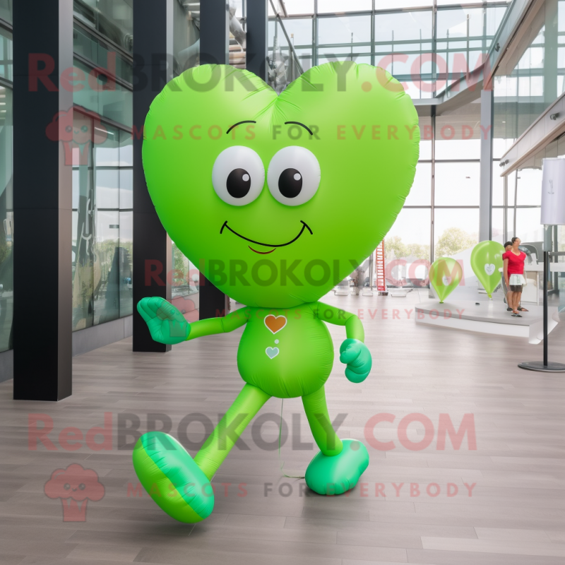 Lime Green Heart Shaped Balloons mascot costume character dressed with a Running Shorts and Smartwatches Lime Green Heart Shaped Balloons mascot costume character dressed with a Running Shorts and Smartwatches