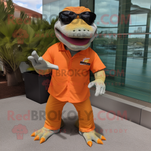 Orange Komodo Dragon mascot costume character dressed with a Bermuda Shorts and Eyeglasses