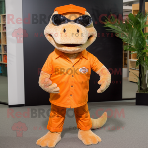 Orange Komodo Dragon mascot costume character dressed with a Bermuda Shorts and Eyeglasses