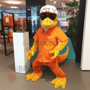 Orange Komodo Dragon mascot costume character dressed with a Bermuda Shorts and Eyeglasses