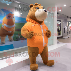 Peach Capybara mascot costume character dressed with a Joggers and Foot pads