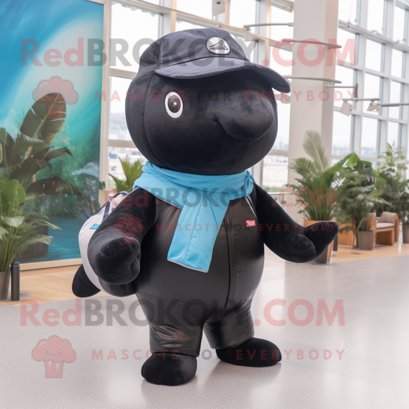 Black Whale mascot costume character dressed with a Jeans and Mittens