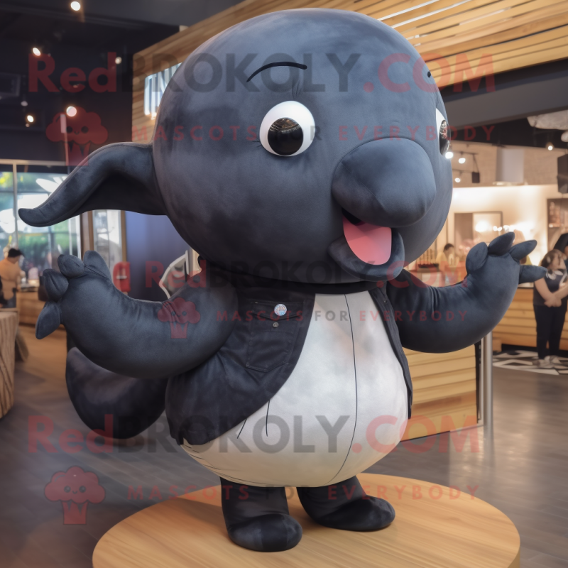 Black Whale mascot costume character dressed with a Jeans and Mittens Black Whale mascot costume character dressed with a Jeans and Mittens