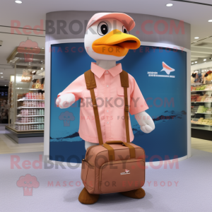 Peach Albatross mascot costume character dressed with a Polo Shirt and Messenger bags