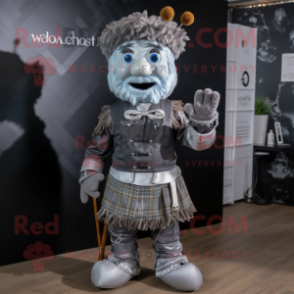 Silver Bagpipe mascot costume character dressed with a Waistcoat and Suspenders
