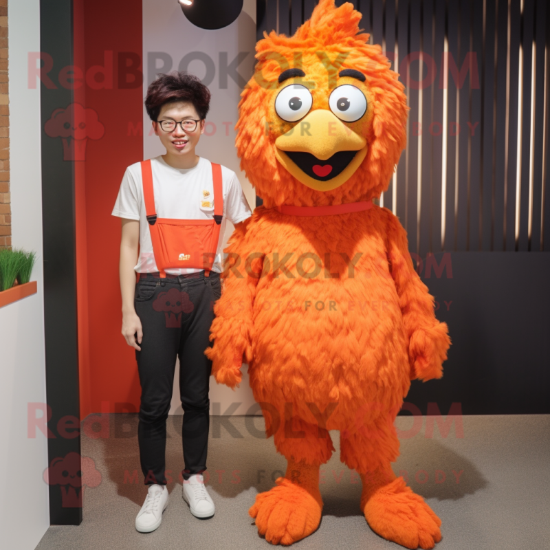 Orange Fried Chicken mascot costume character dressed with a Skinny Jeans and Suspenders Orange Fried Chicken mascot costume character dressed with a Skinny Jeans and Suspenders