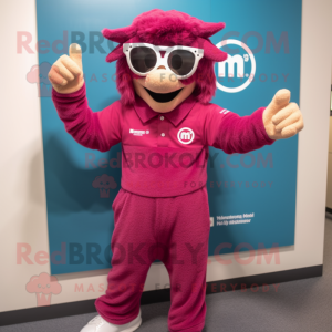 Magenta Momentum mascot costume character dressed with a Romper and Reading glasses