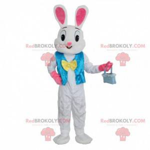 Mascotte de lapin blanc et rose avec un gilet bleu -