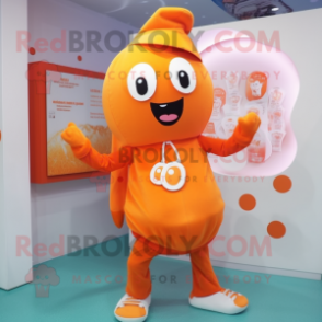 Orange Pendant mascot costume character dressed with a Playsuit and Scarf clips
