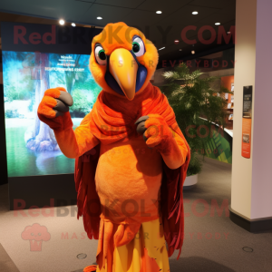 Orange Macaw mascot costume character dressed with a Cover-up and Scarves