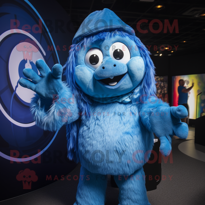 Blue Momentum mascot costume character dressed with a Playsuit and Rings Blue Momentum mascot costume character dressed with a Playsuit and Rings