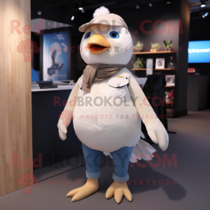 Beige Dove mascot costume character dressed with a Jeans and Anklets