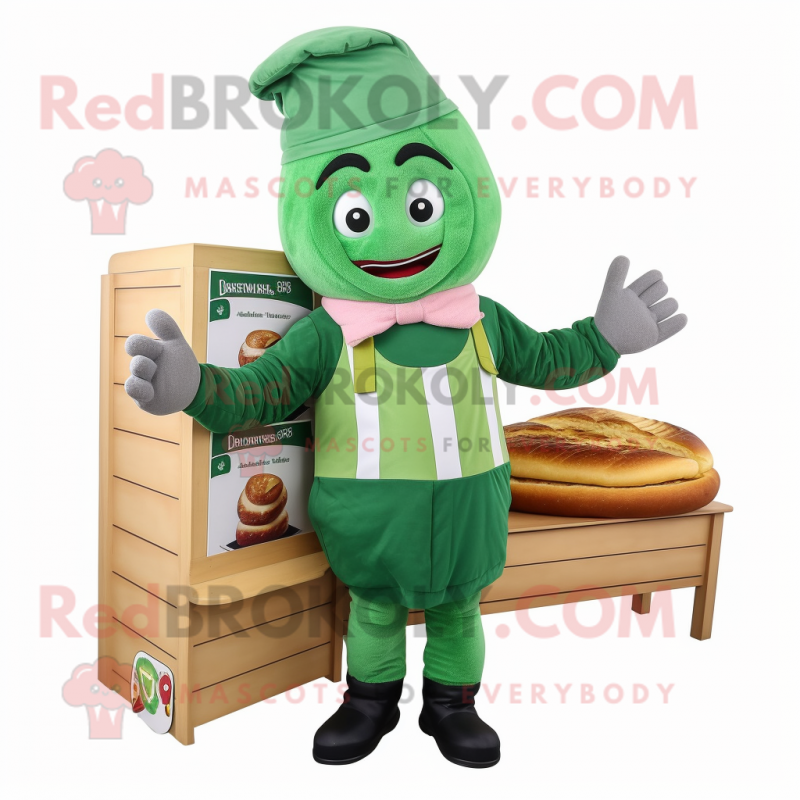 Green Croissant mascot costume character dressed with a Dungarees and Beanies Green Croissant mascot costume character dressed with a Dungarees and Beanies