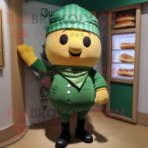 Green Croissant mascot costume character dressed with a Dungarees and Beanies
