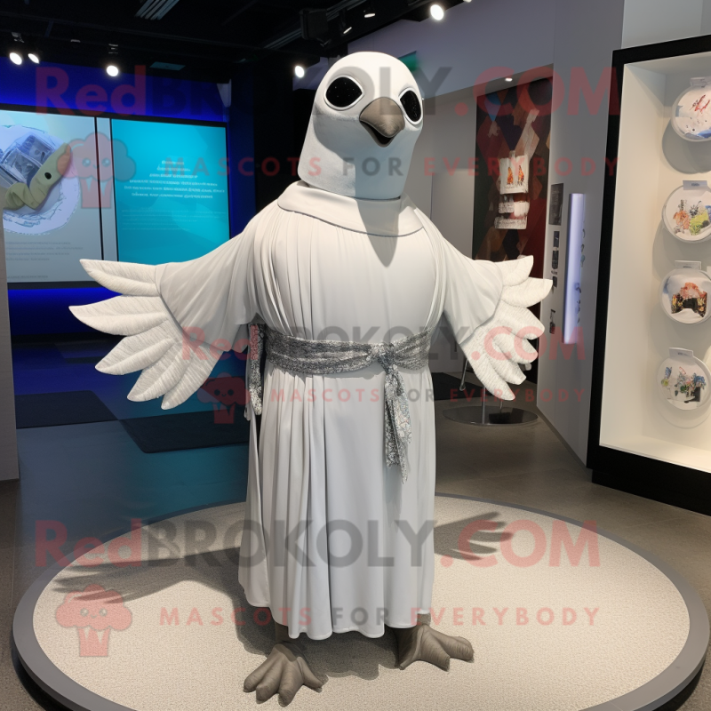 Silver Dove mascot costume character dressed with a Cover-up and Belts Silver Dove mascot costume character dressed with a Cover-up and Belts