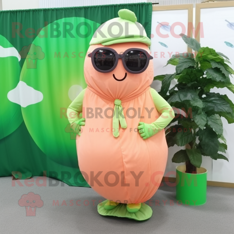 Peach Cucumber mascot costume character dressed with a Wrap Skirt and Sunglasses Peach Cucumber mascot costume character dressed with a Wrap Skirt and Sunglasses