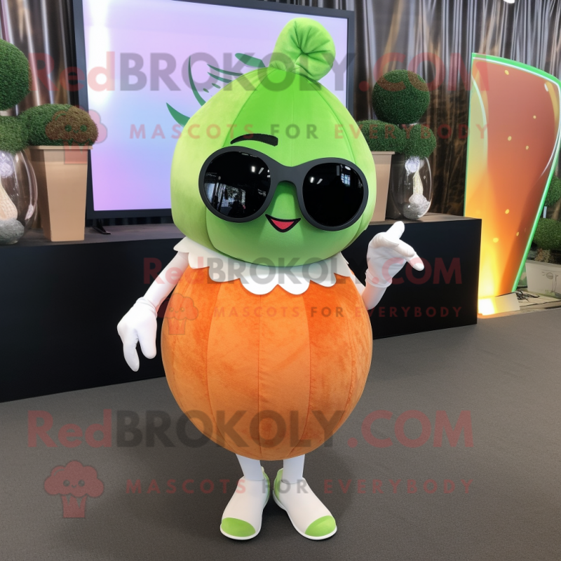 Peach Cucumber mascot costume character dressed with a Wrap Skirt and Sunglasses Peach Cucumber mascot costume character dressed with a Wrap Skirt and Sunglasses